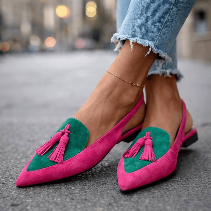 Lifestyle image of a person walking in the comfortable suede strappy sandals, capturing movement.